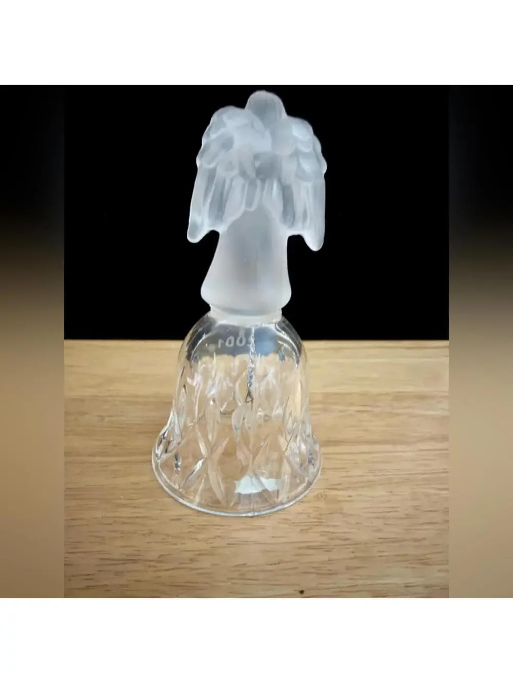vintage frosted angel sits atop a crystal bell etched with the year 2001.